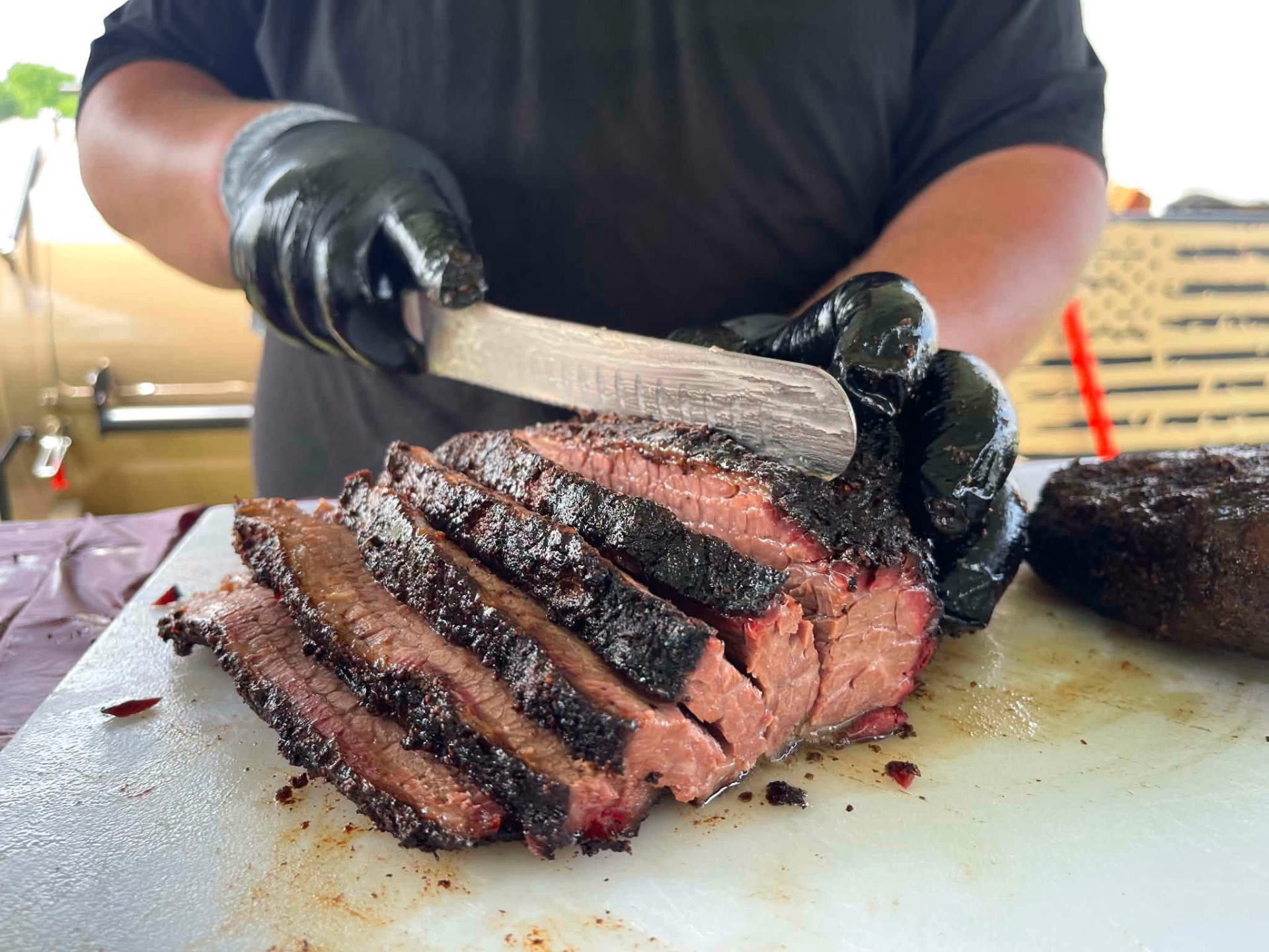Smoked brisket sliced by pitmaster