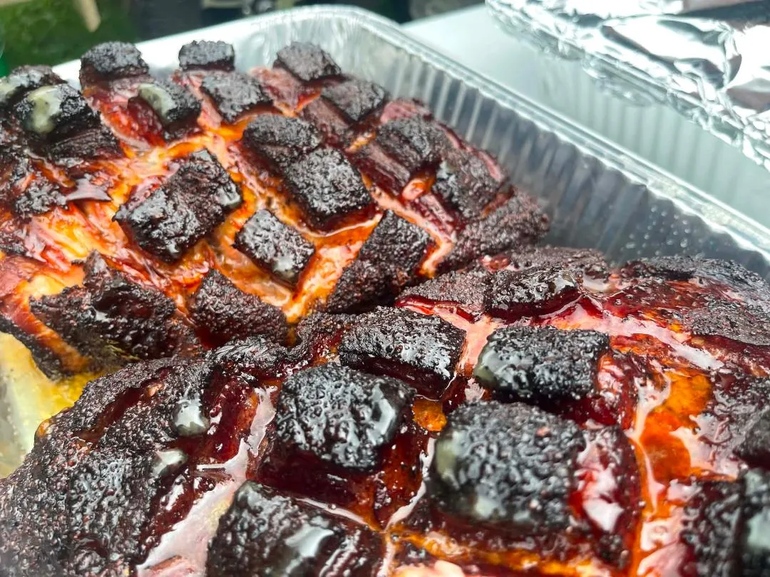 Bourbon maple pork burnt ends glazed in a pan